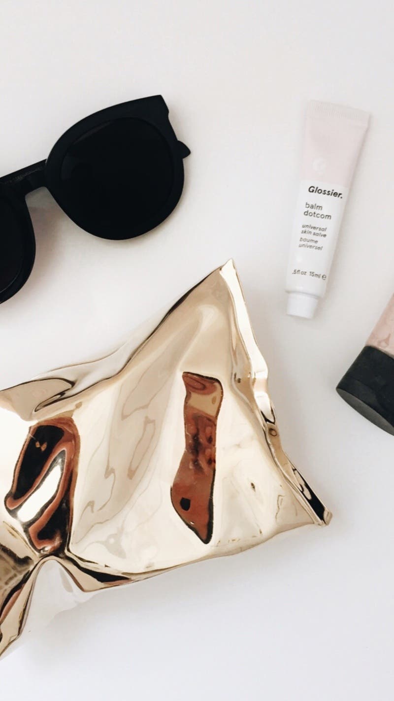 Gold Crisp Packet Clutch by Anya Hindmarch | Rent the Runway